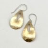 Handcrafted brass teardrop earrings with a hammered finish and Argentium sterling ear wires